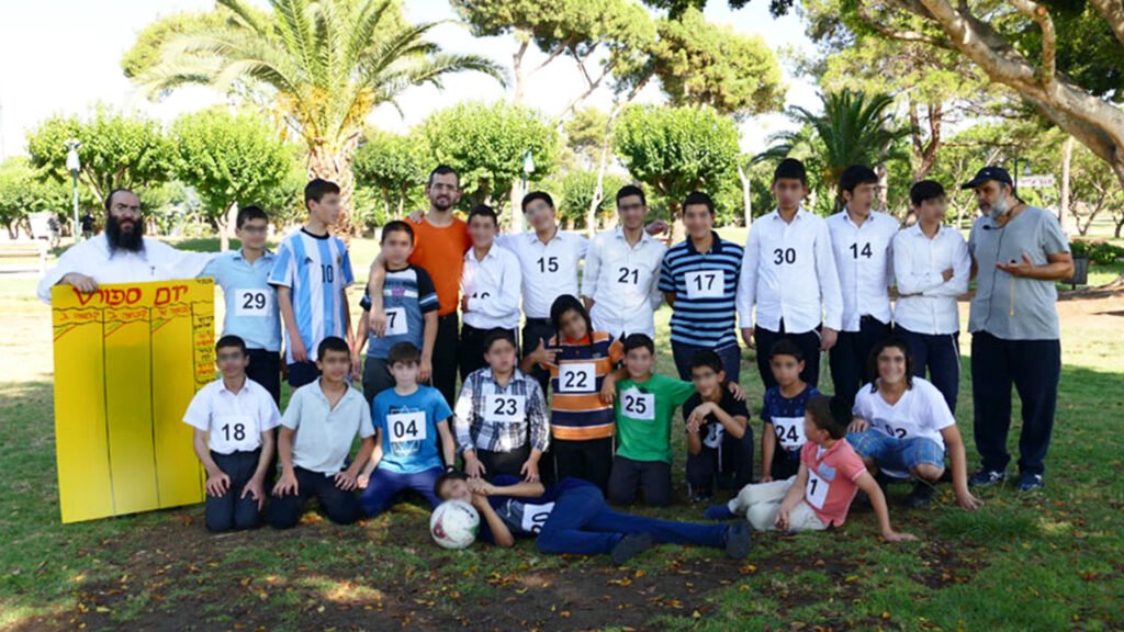 Keren Hayeled boys on a sports outing, posed for a group photograph