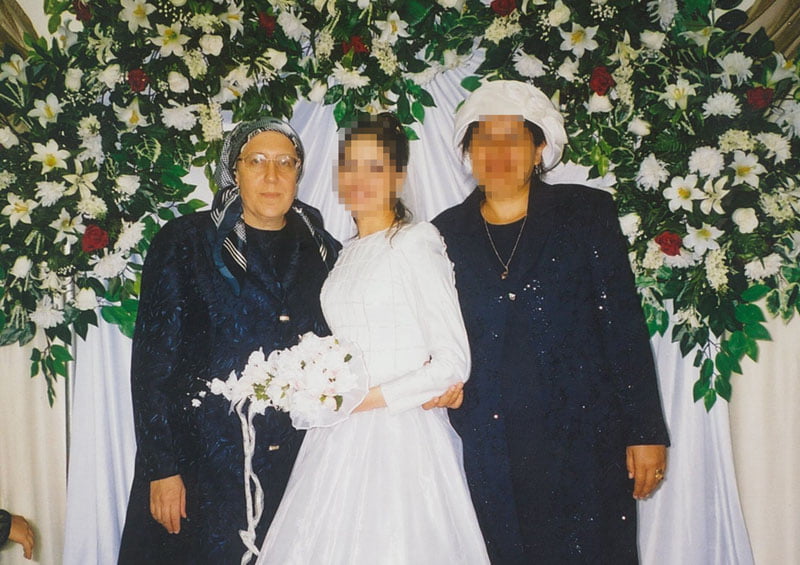 Perl Godlewsky, founder of the Keren Hayeled Orphanage in Israel, standing with a graduate of the orphanage at her wedding
