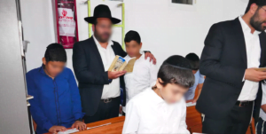 Keren Hayeled staff praying the Selichot prayer along with the children of the orphanage